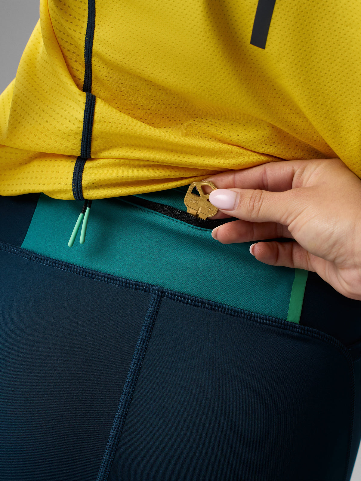 Women's Rabbit Pacer Shorts 4". Dark blue colorway. Back view.