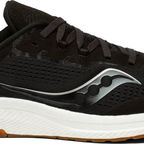 Women's Saucony Freedom 4. Black upper. White midsole. Lateral view.