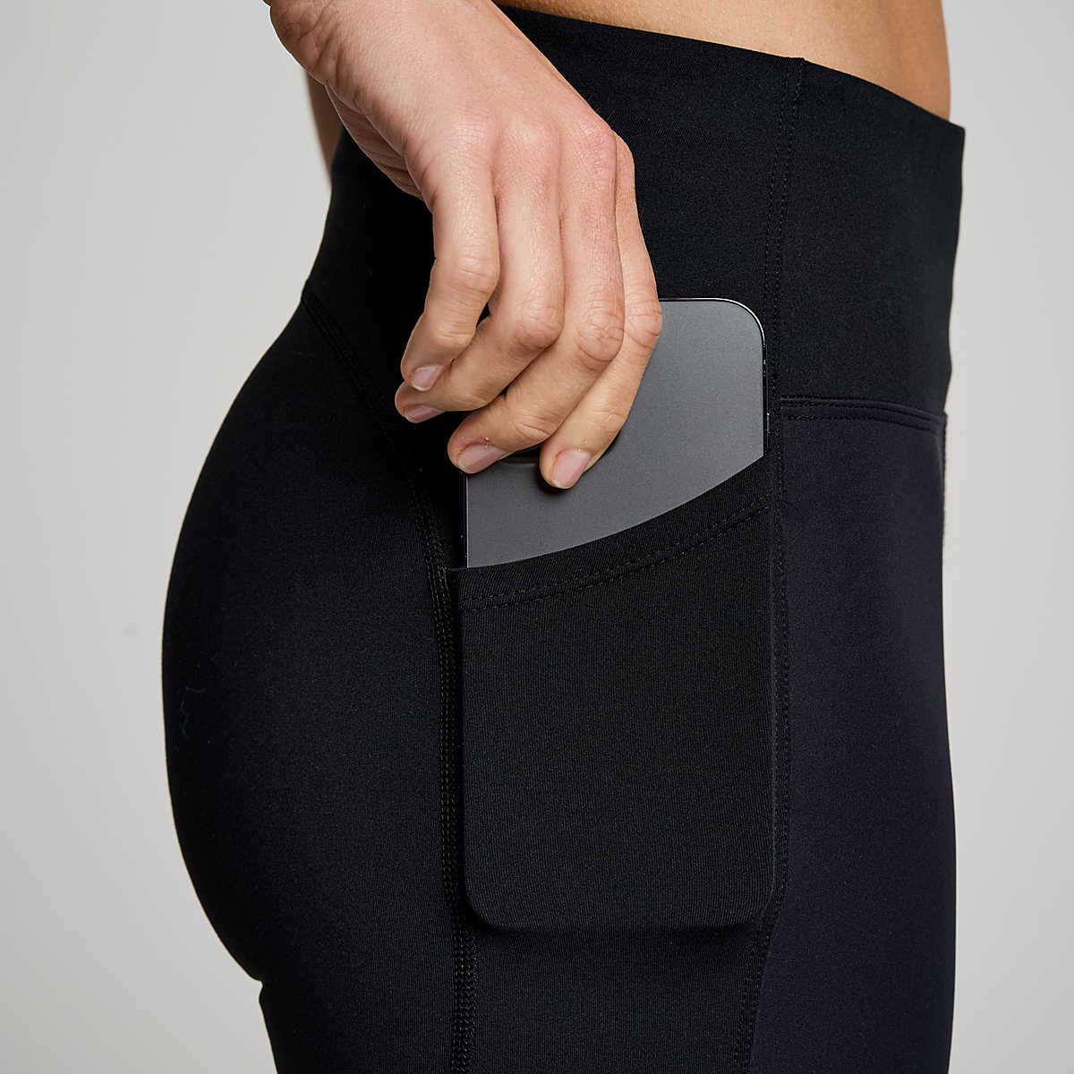 Women's Saucony RunShield Tights. Black. Side pocket closeup.