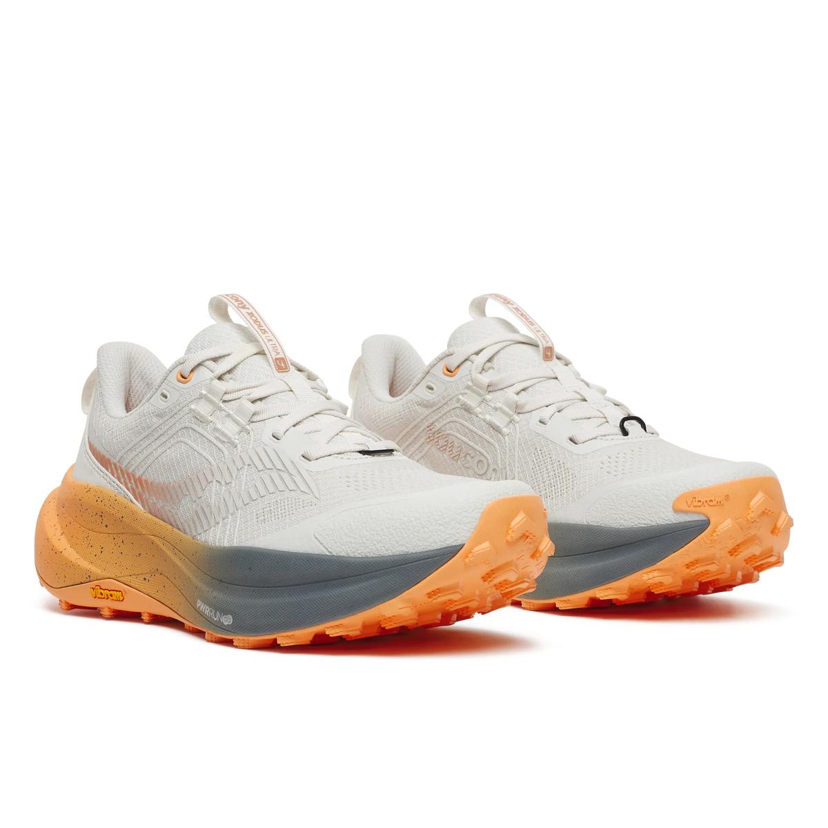 Women's Saucony Xodus Ultra 4. White upper. Orange midsole. Lateral view.