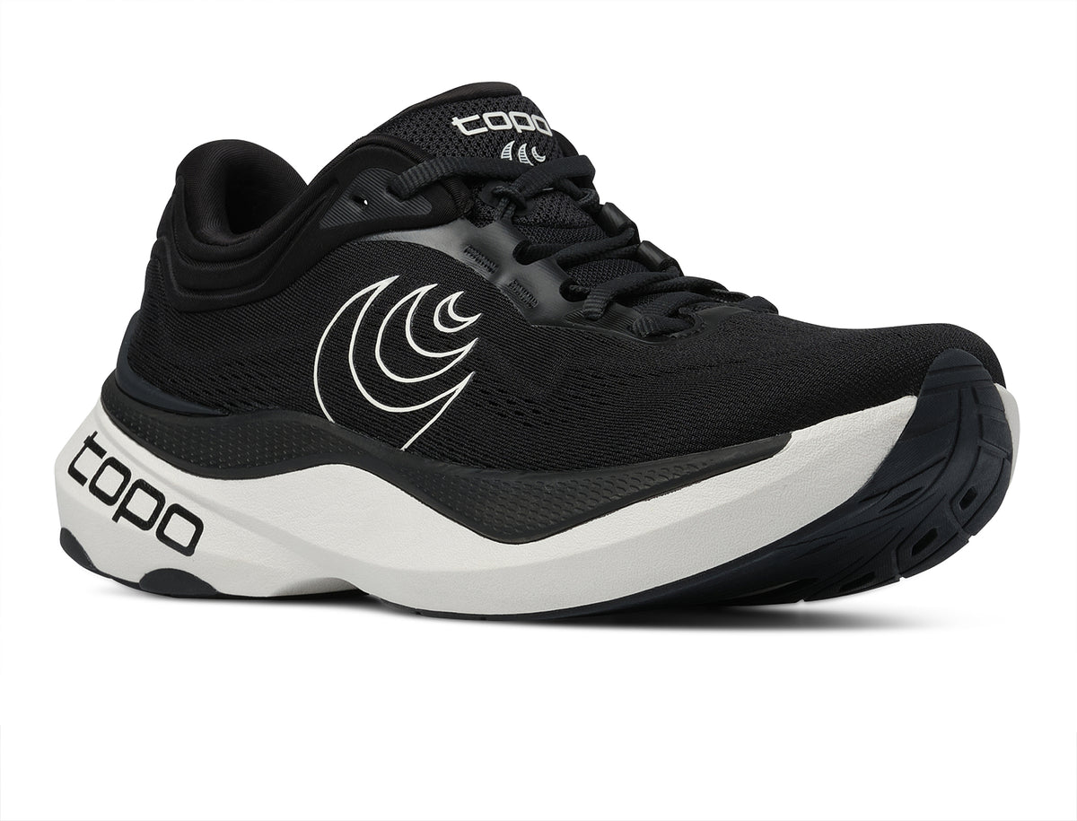 Women's Topo Aura 2. Black upper. White midsole. Lateral view.