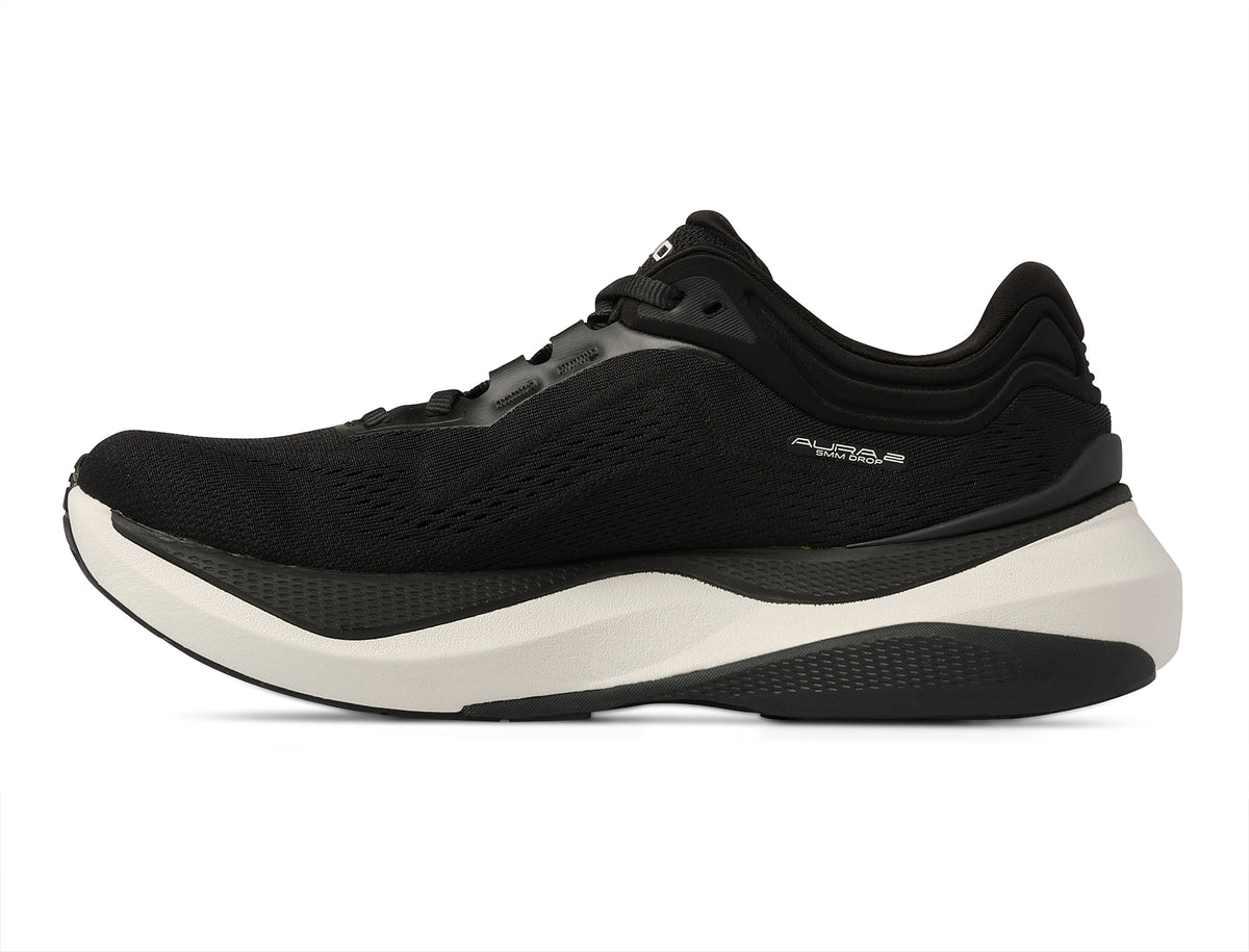 Women's Topo Aura 2. Black upper. White midsole. Medial view.