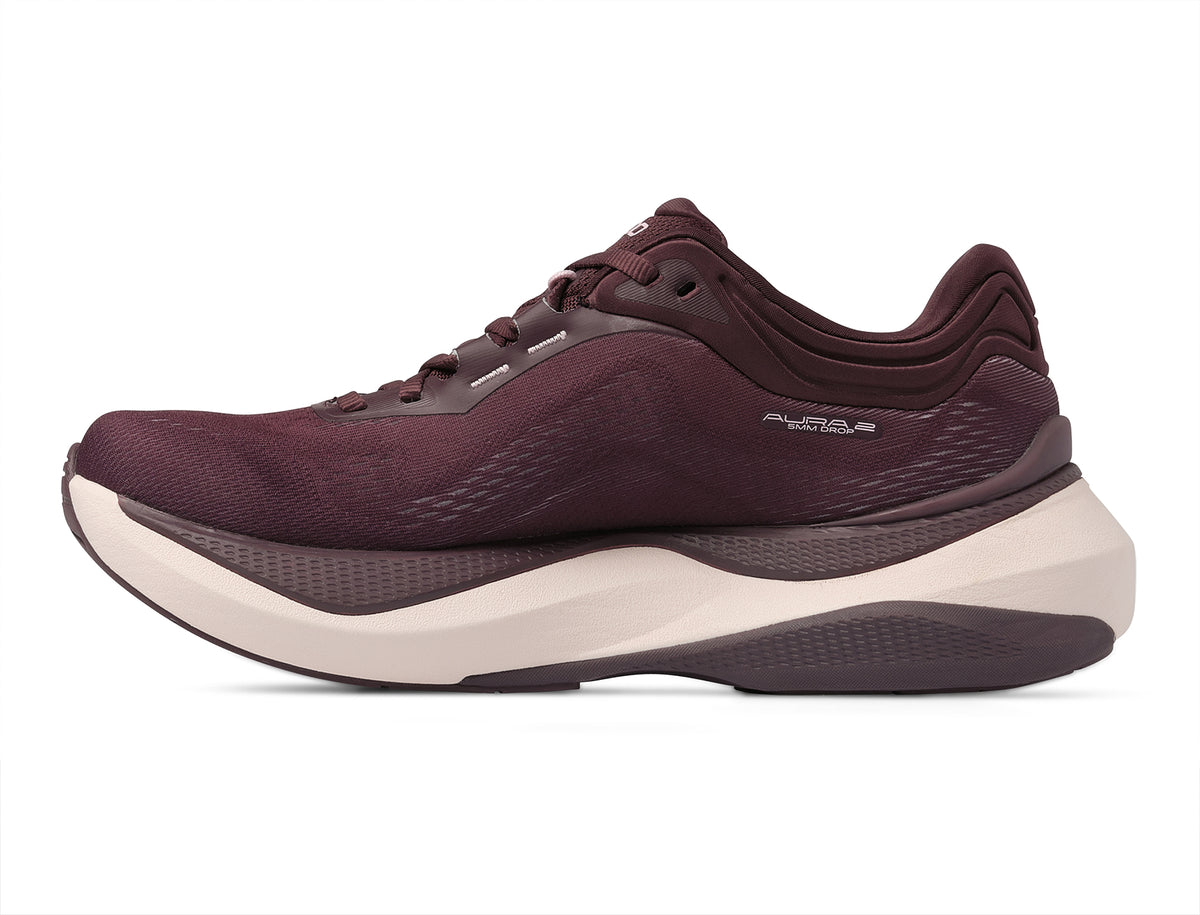 Women's Topo Aura 2. Maroon upper. White midsole. Medial view.