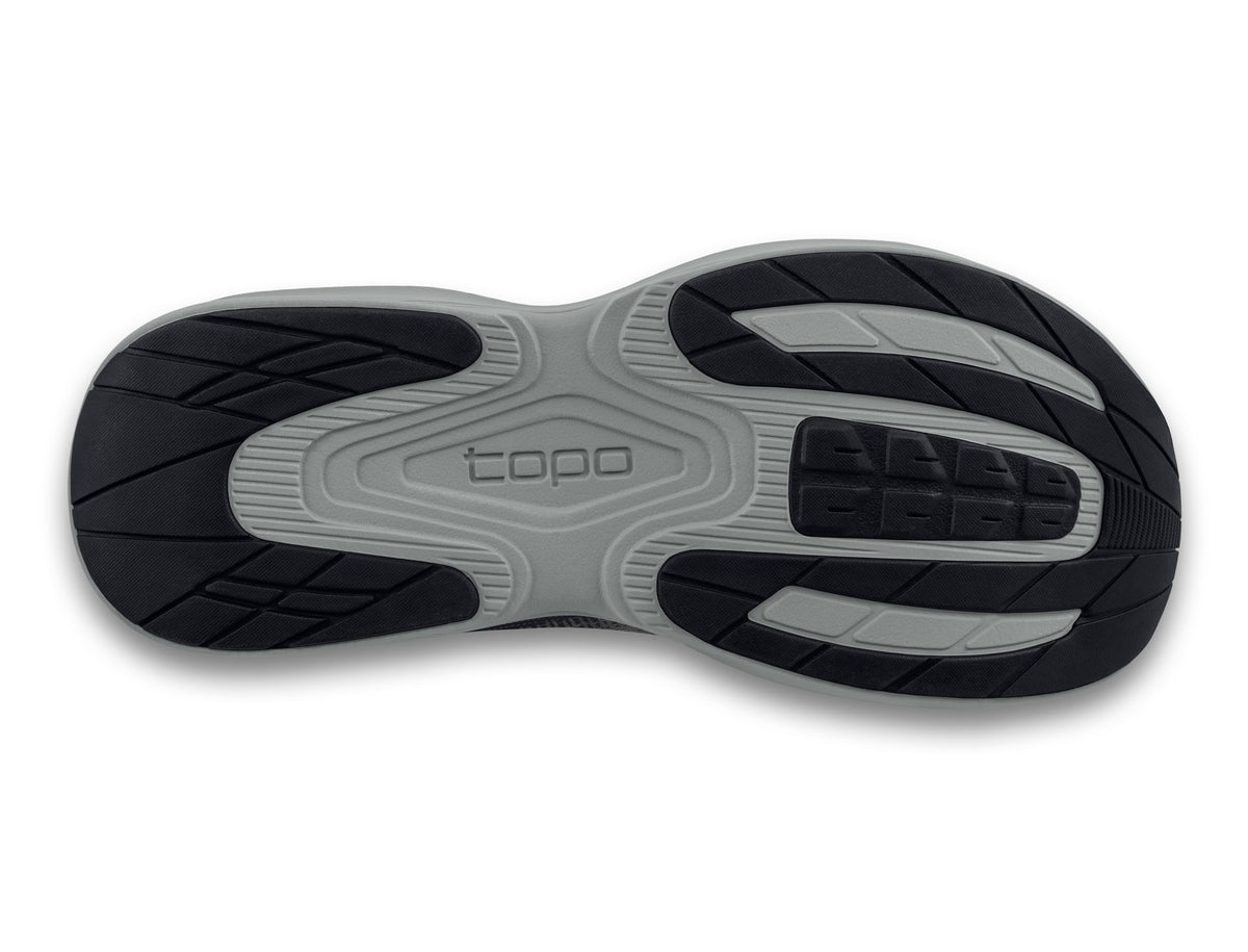 Women's Topo Fli-Lyte 6. Dark Grey upper. Grey midsole. Bottom view.
