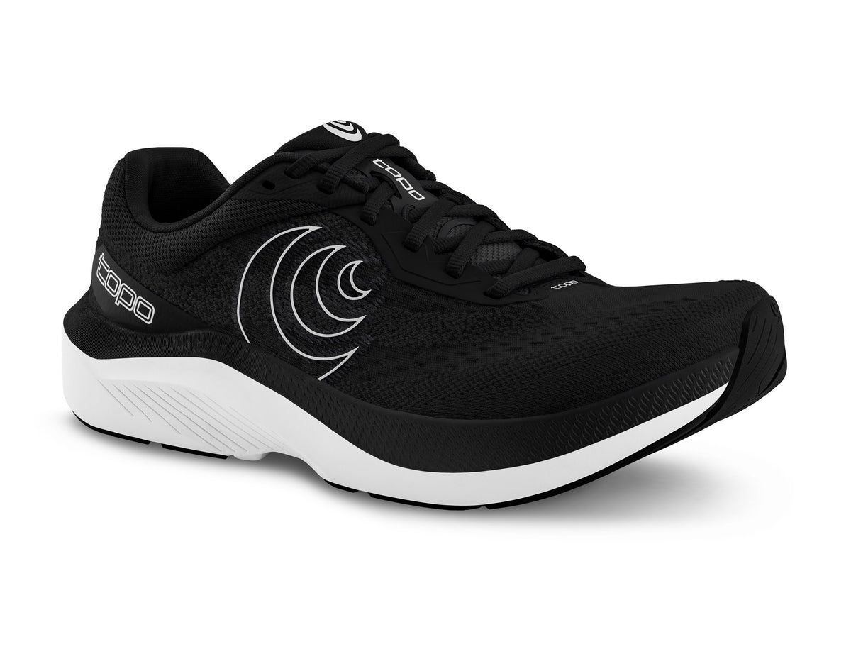 Women's Topo Magnifly 6. Black upper. White midsole. Lateral view.