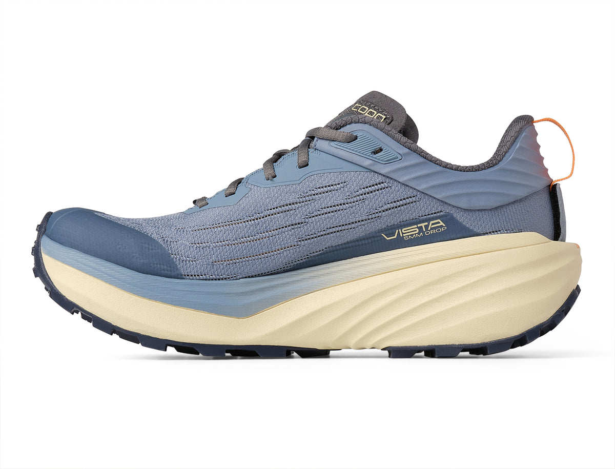 Women's Topo Vista. Blue upper. Tan midsole. Medial view.