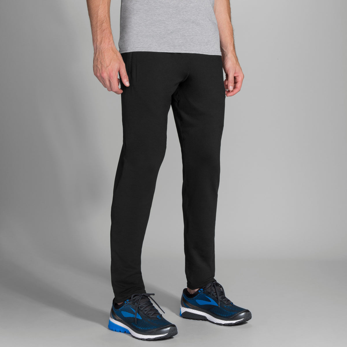 Men's Brooks Spartan Pants. Black. Front/Lateral view.