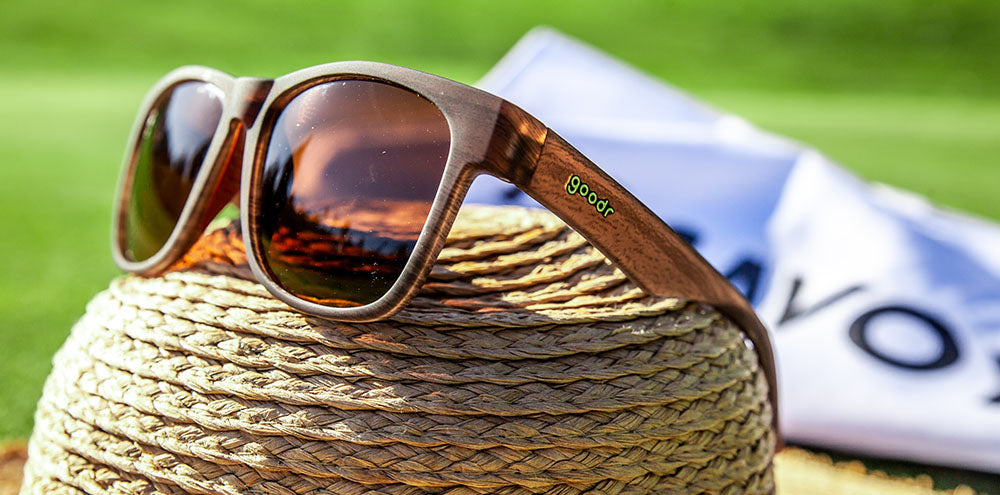 Goodr Sunglasses. BFG. Woodgrain frame. Brown lenses. Front/Lateral view.