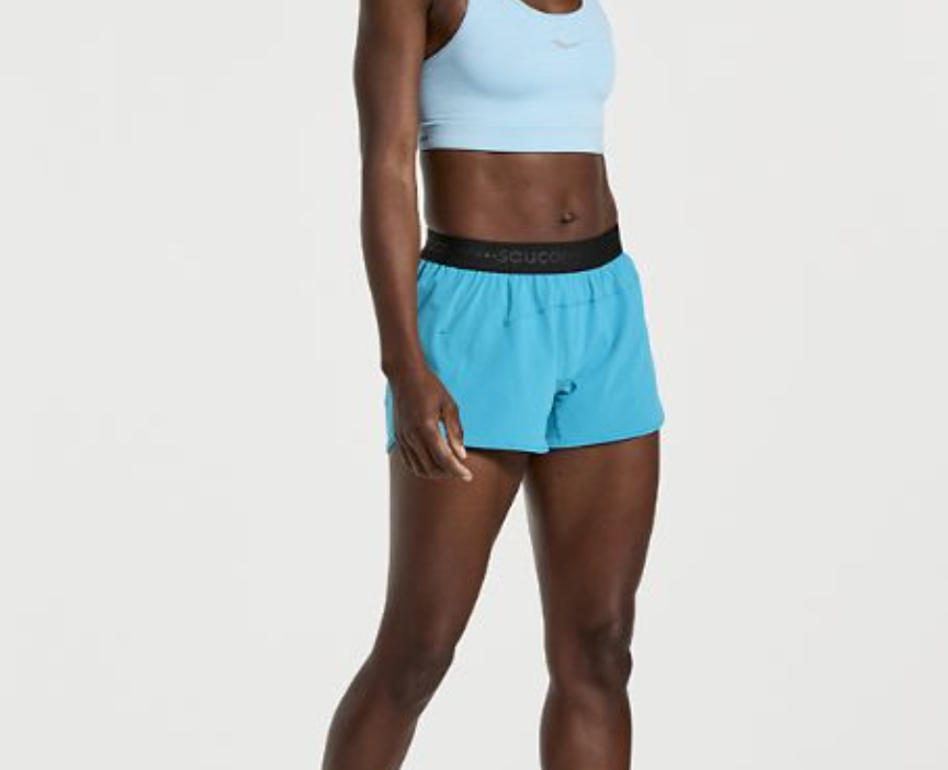 Women's Saucony Outpace Shorts. Green/Blue. Front view.