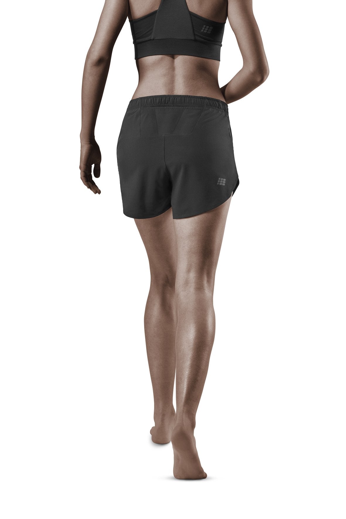 Women's CEP Race Loose Fit Shorts. Black. Rear view.