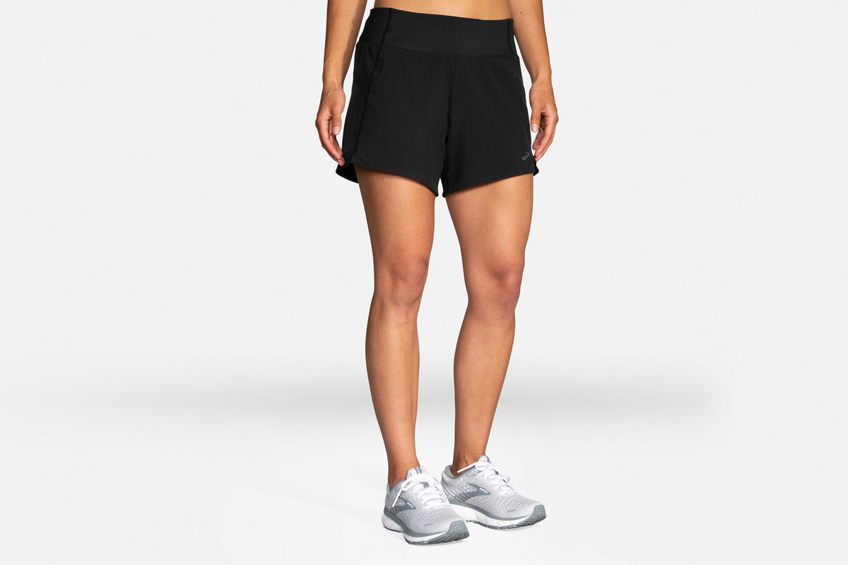 Women's Brooks Chaser 5" Shorts. Black. Front view.