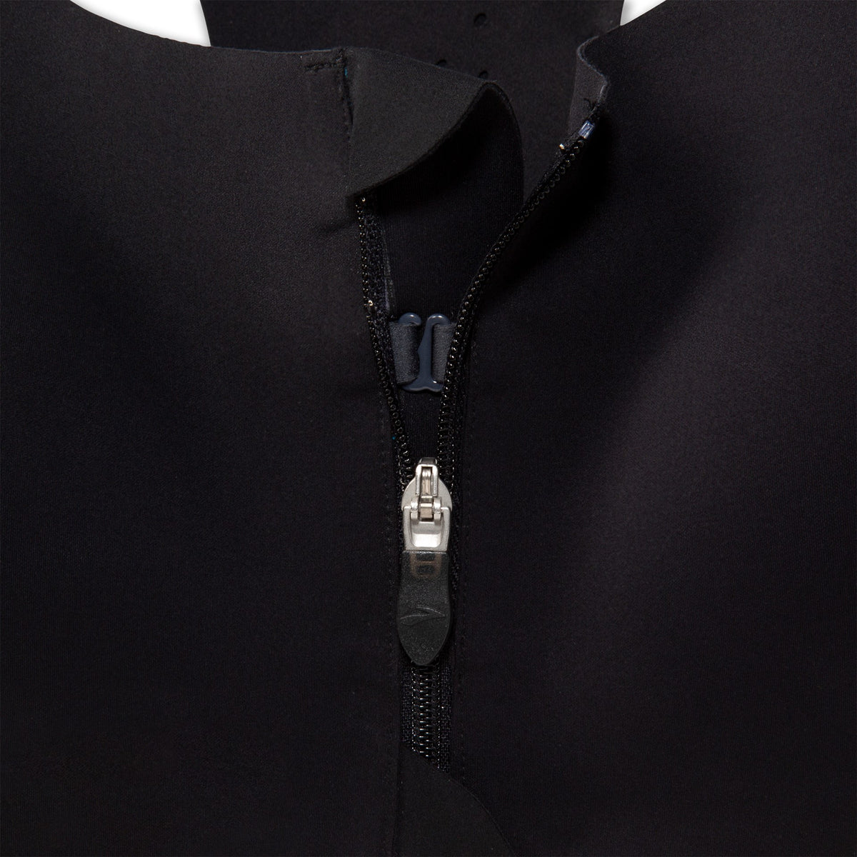 Women's Brooks Dare Zip Run 2.0. Black. Front zip closeup.