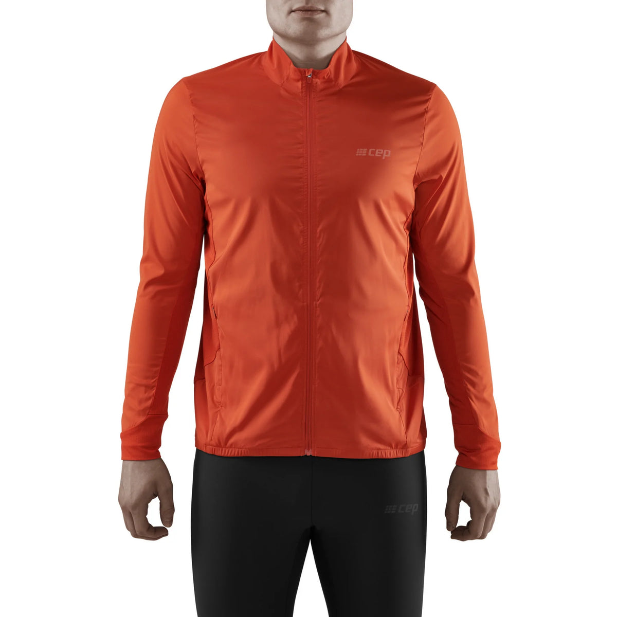 Men's CEP Cold Weather Windbreaker. Dark Orange. Front view.