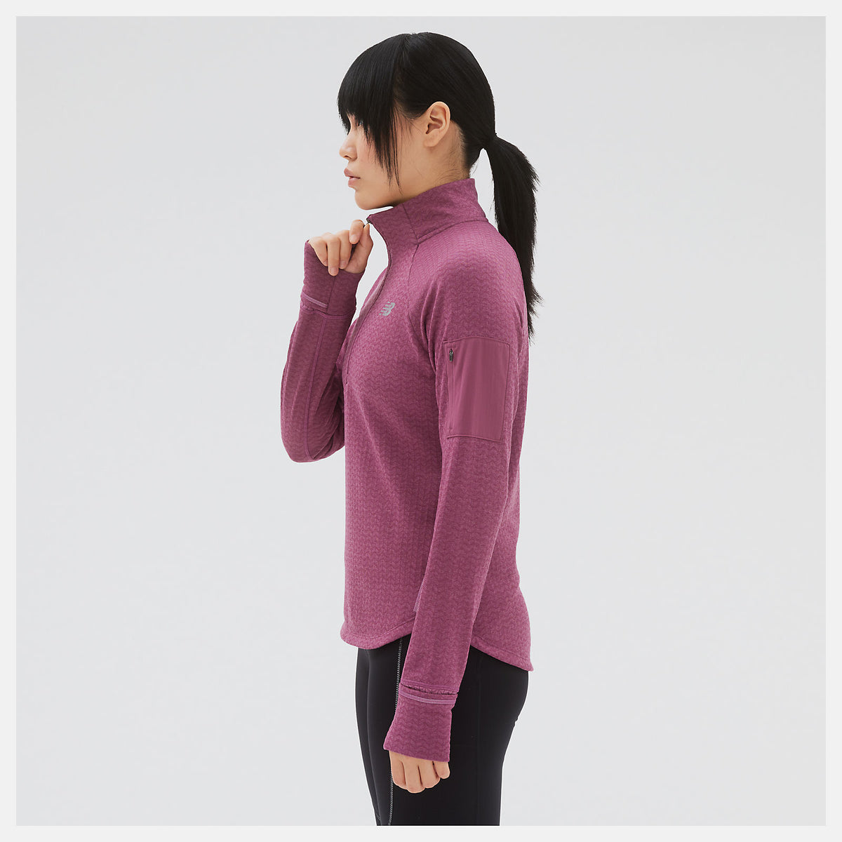 Men's New Balance Heat Grid Half-Zip. Dark Pink. Lateral view.