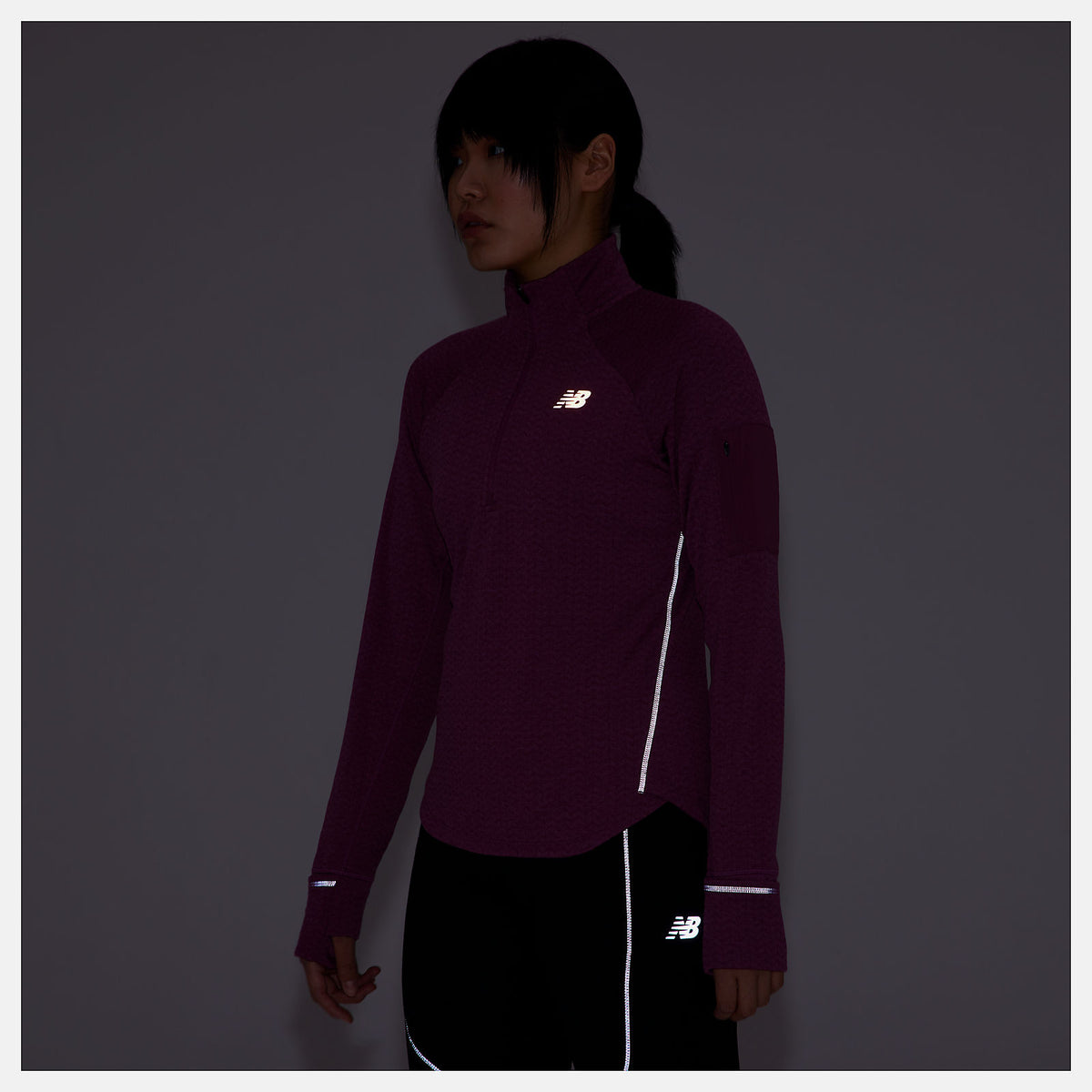Men's New Balance Heat Grid Half-Zip. Dark Pink. Front view.
