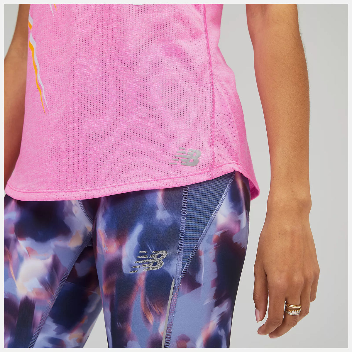 Women's New Balance Impact Tank. Pink. Logo closeup.