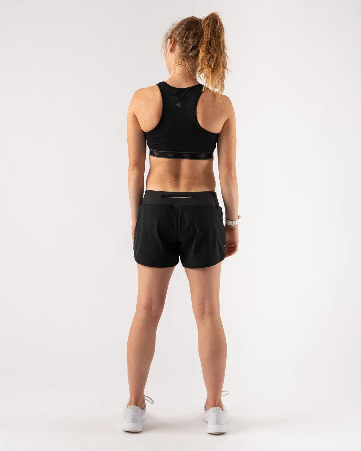 Women's rabbit Sports Bra. Black. Rear view.