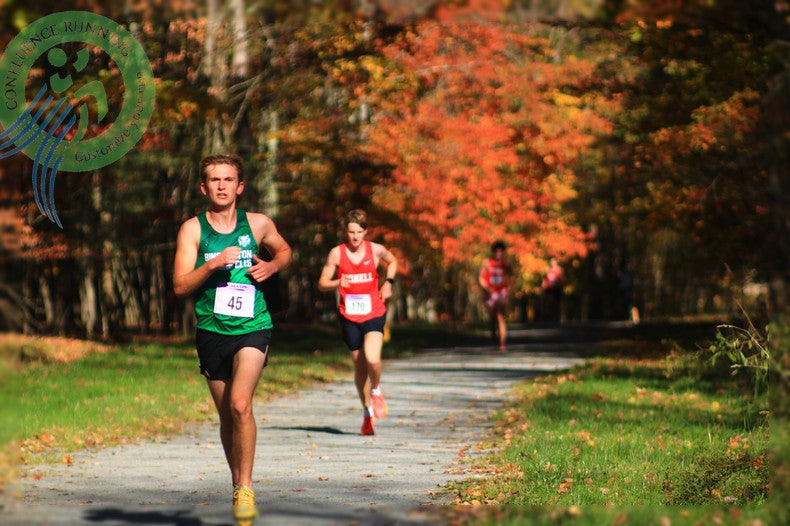 Binghamton runner in green ahead of Cornell competitors on the 2026 BRC Open men's cross country course