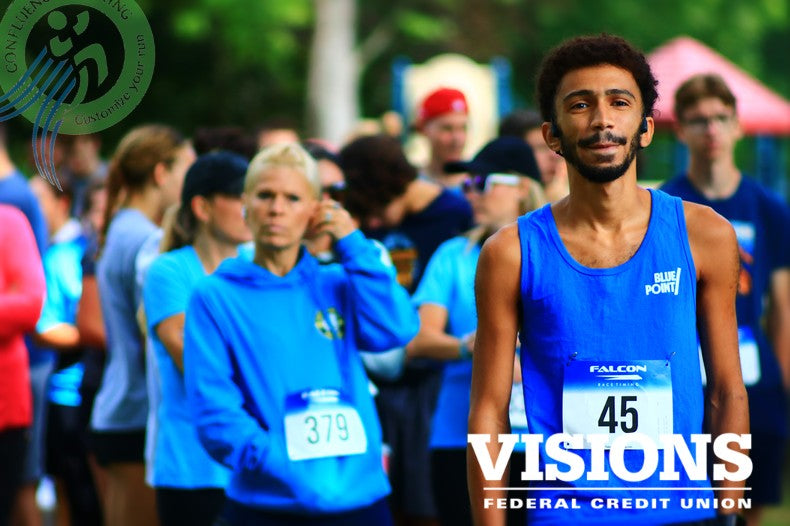 Participants at the Sock Out Cancer 5K, an Upstate New York road race, proudly showing support for local cancer patients at Otsiningo Park