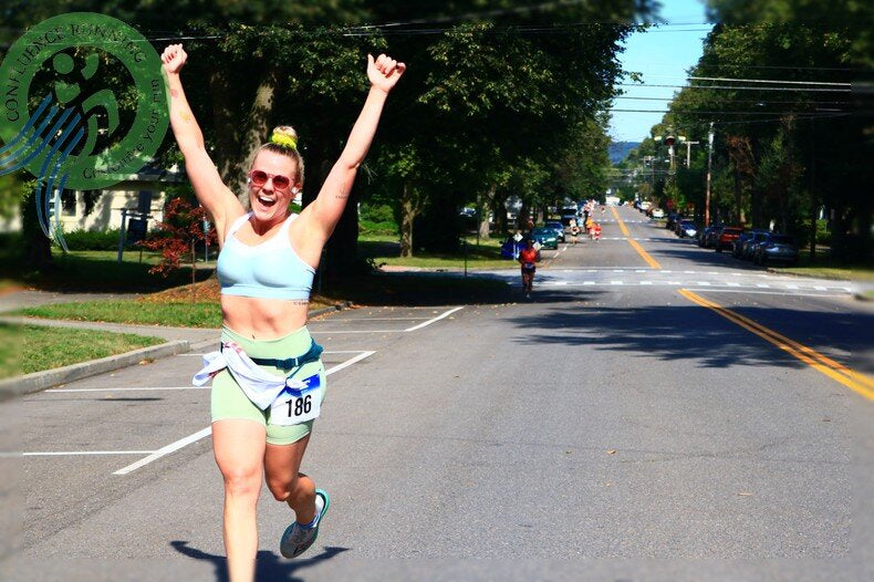 “Crowds cheering relay teams during Harper’s 10K livestream handoff point”