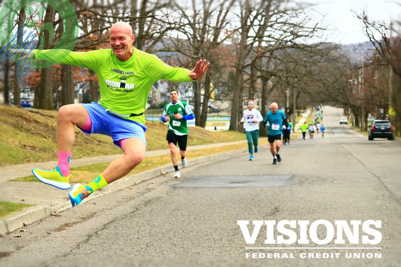 Bob Stocks, runner, clicking his heels at the St Pats 4 Miler Binghamton NY