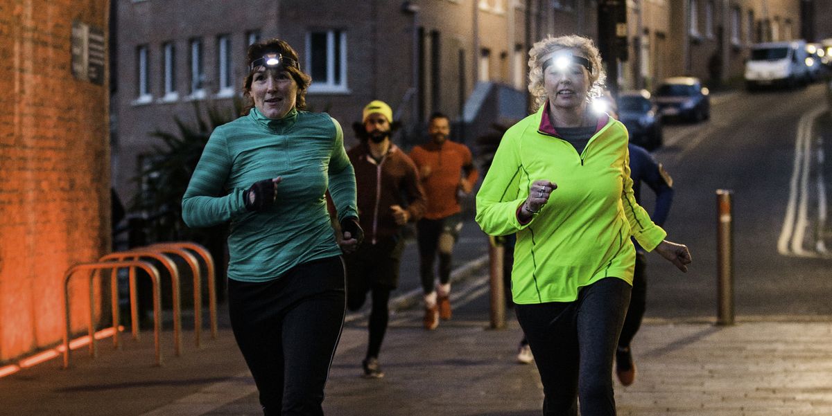 Runners using headlamps and reflective apparel during their night workout