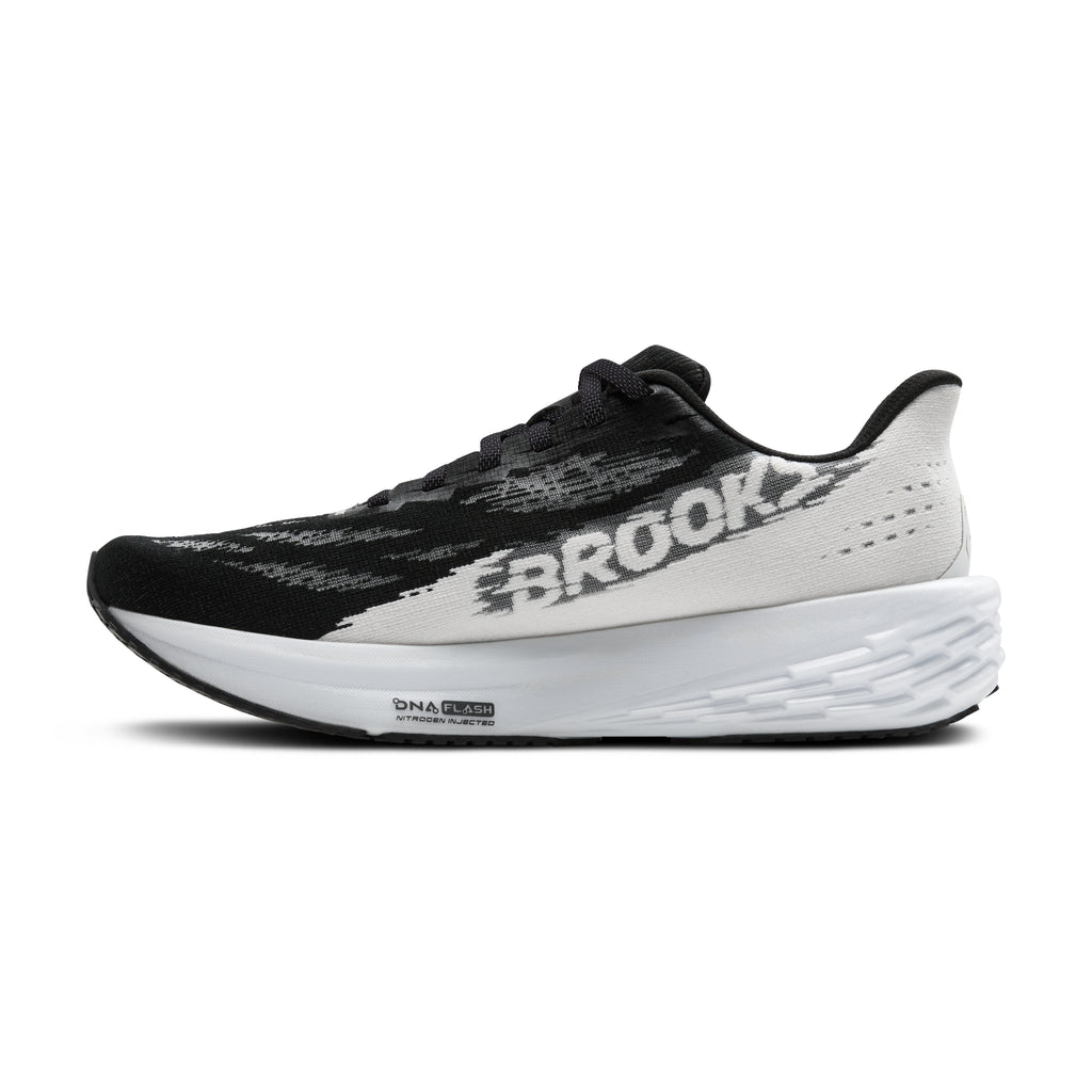Men's Brooks Launch 11. Black/White upper. Black/White midsole. Medial view.