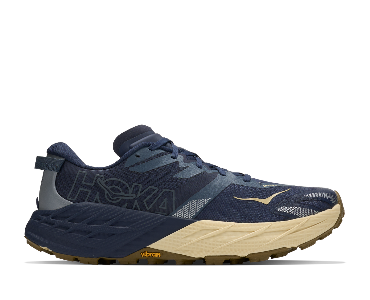 Men's HOKA Speedgoat 7 in Varsity Navy/Barley Flour, lateral view.