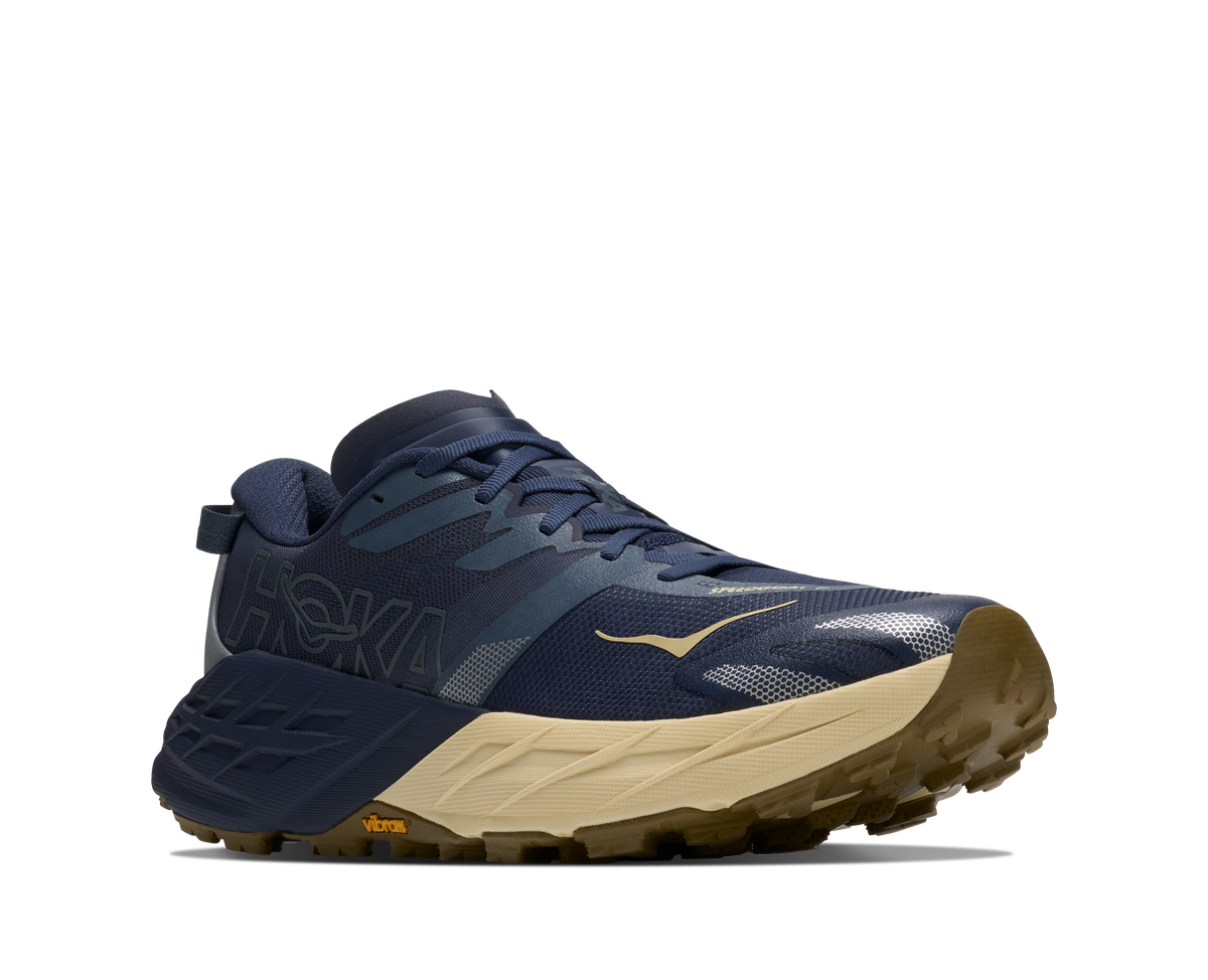 Men's HOKA Speedgoat 7 in Varsity Navy/Barley Flour, lateral view.