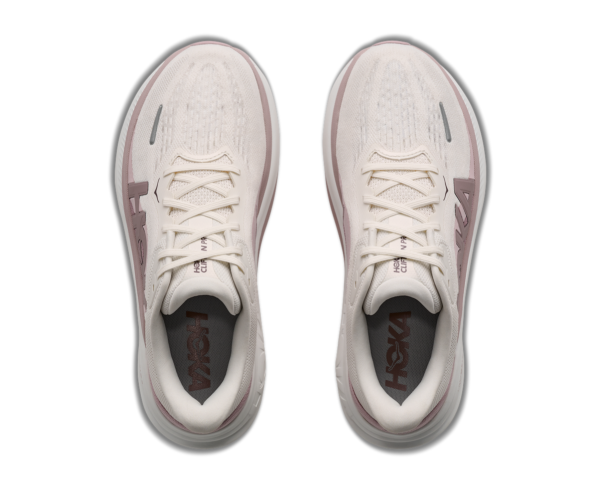 Women's HOKA Clifton Pro in Alabaster/Pink Opal, top view.