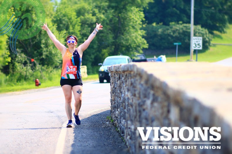 Runner celebrating on the 1812 Challenge Weekend course in Sackets Harbor