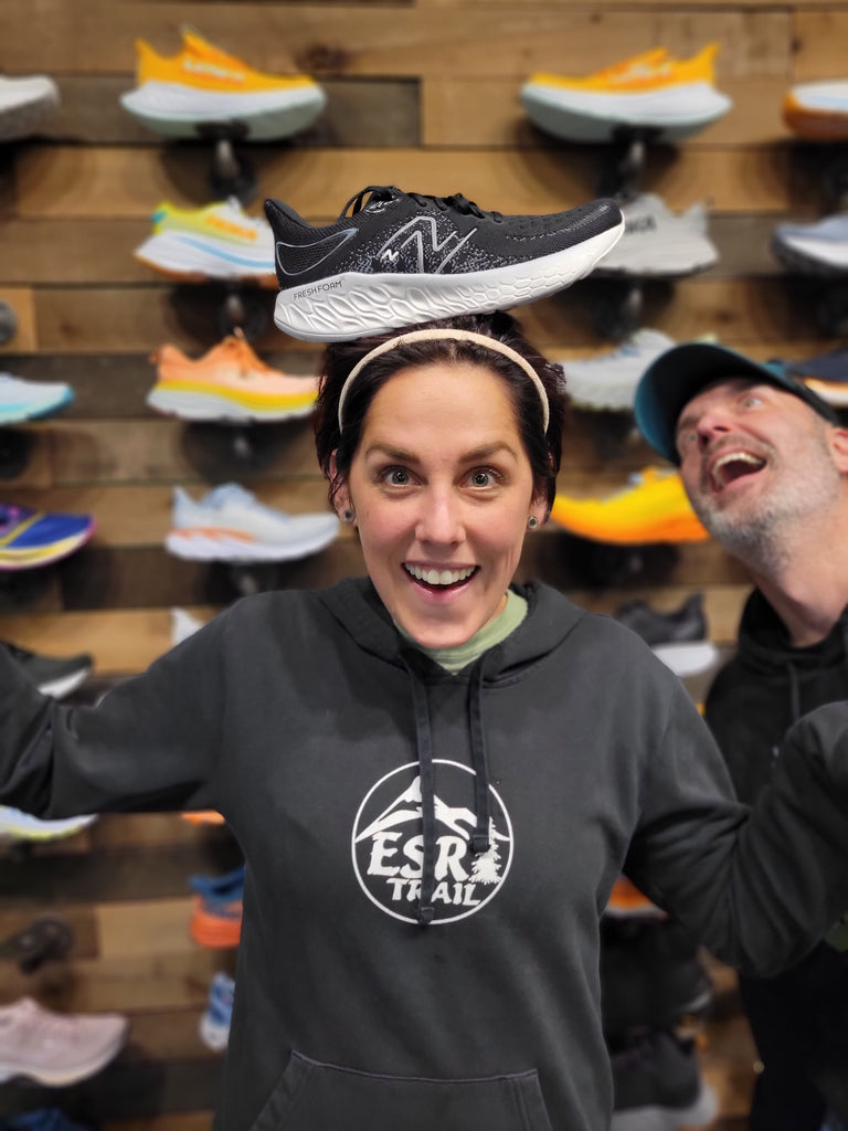 Employee with her favorite shoe: The New Balance 1080 (in Black and white)