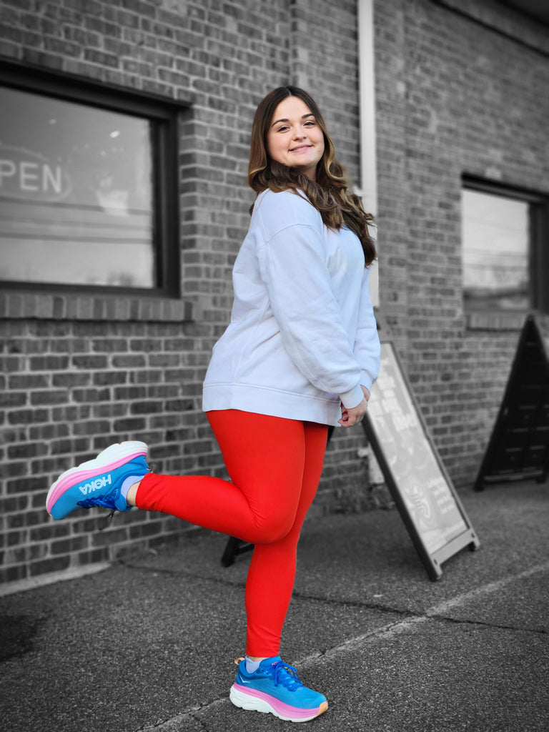 Employee with her favorite shoe: The Hoka Bondi in blue and pink