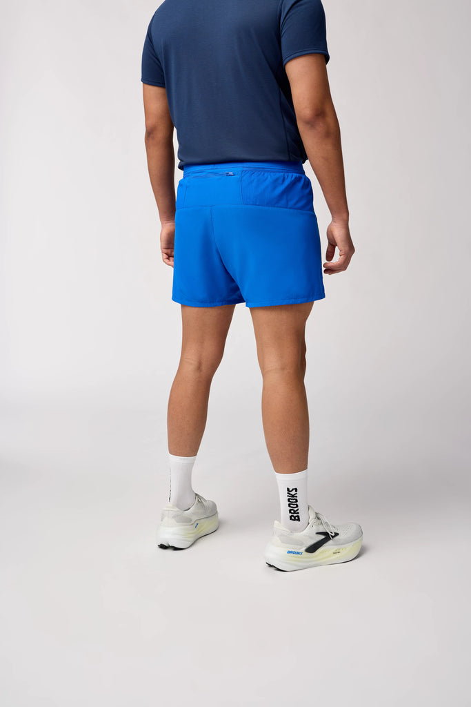 Men's Brooks Journey Shorts. Blue. Rear/Lateral view.