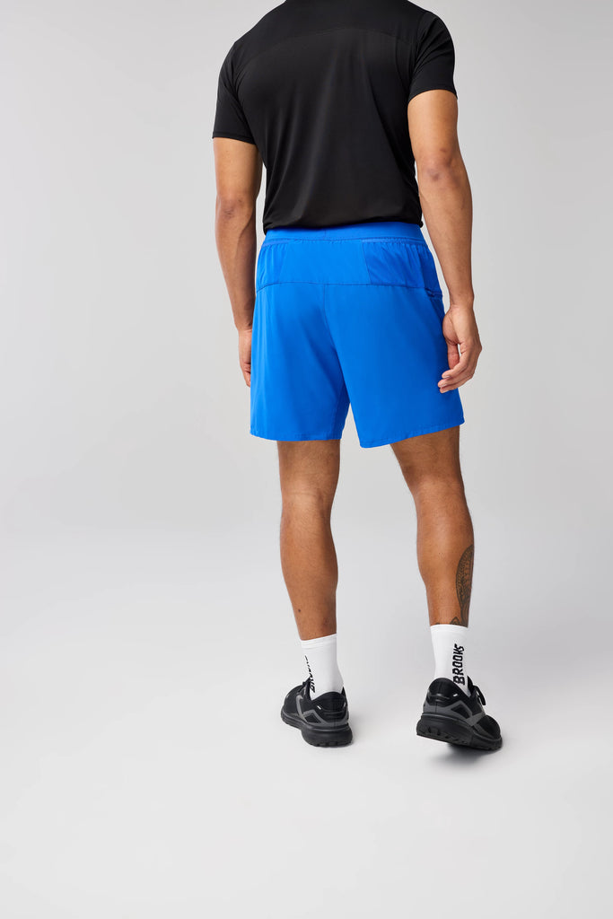 Men's Brooks Journey 7" Shorts. Blue. Rear view.