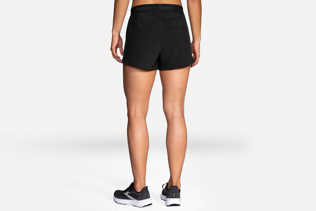 Women's Brooks Chaser 3" Shorts. Black. Rear view.