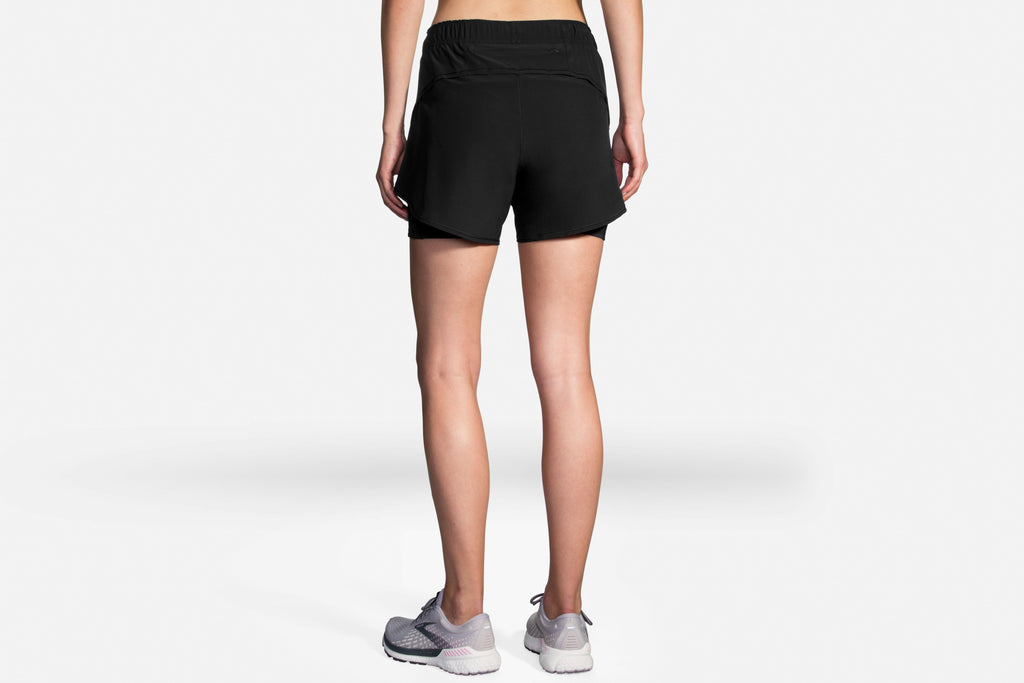 Women's Brooks Chaser 5" 2-in-1 Shorts. Black. Rear view.