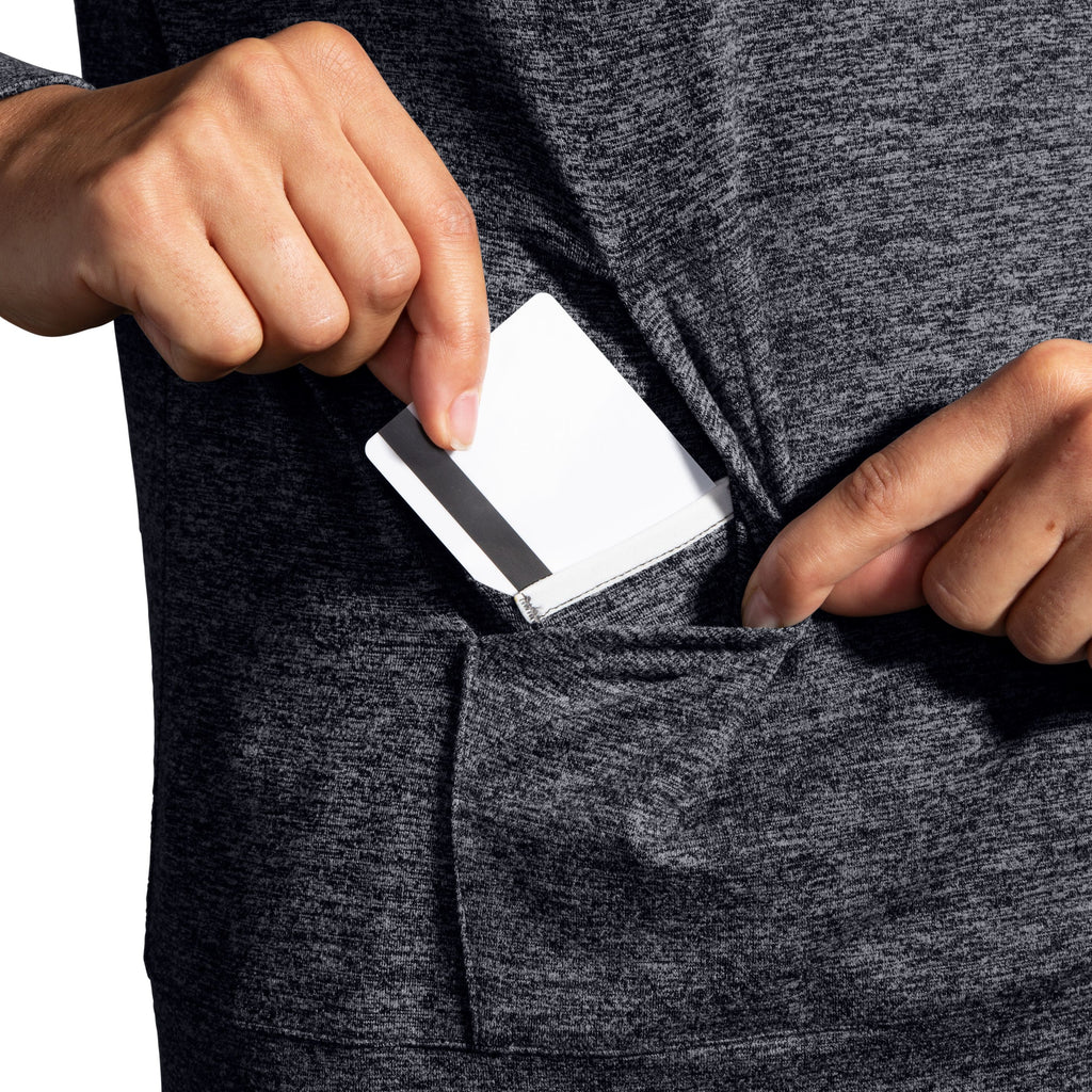 Women's Brooks Luxe Hoodie. Black. Pocket closeup.