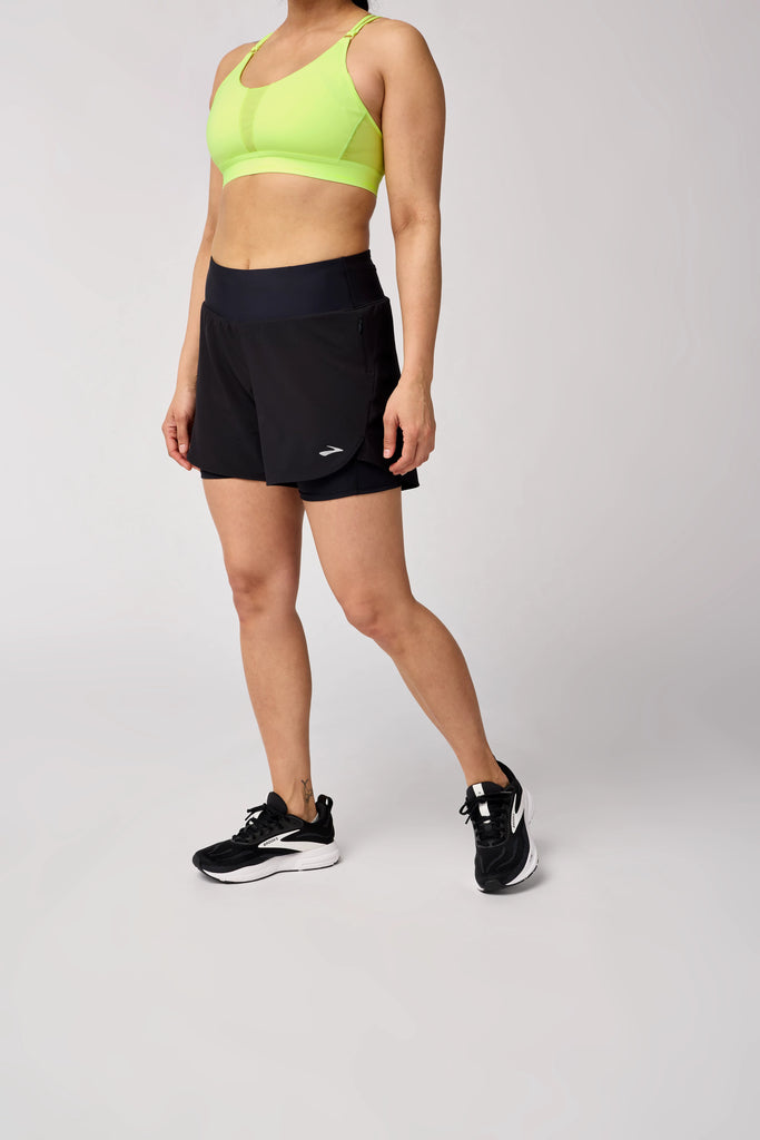 Women's Brooks Chaser 5" 2-in-1 Shorts. Black. Front view.