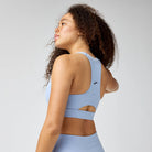 Women's Brooks Luxe Pocket Sports Bra in Heather Halogen Blue, back view