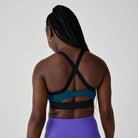 Women's Brooks Luxe Strappy Sports Bra in Cosmo/Black, back view.