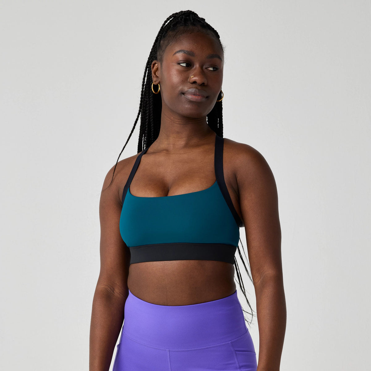 Women's Brooks Luxe Strappy Sports Bra in Cosmo/Black, front view.