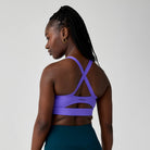 Women's Brooks Luxe Strappy Sports Bra in Violet, back view.
