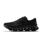 Men's On Running. Cloudmonster 3. Black upper. Black midsole. Medial view.