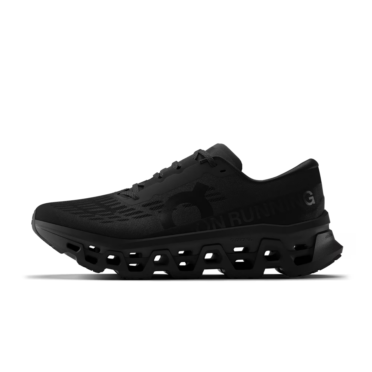 Men's On Running. Cloudmonster 3. Black upper. Black midsole. Medial view.