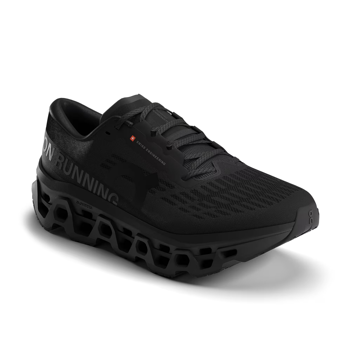 Men's On Running. Cloudmonster 3. Black upper. Black midsole. Lateral view.