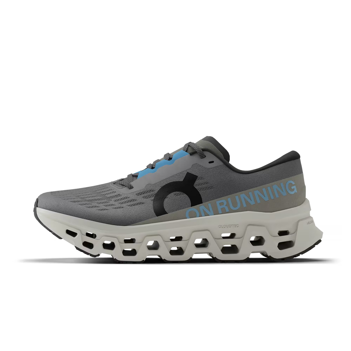 Men's On Running. Cloudmonster 3. Grey upper. Off White midsole. Medial view.