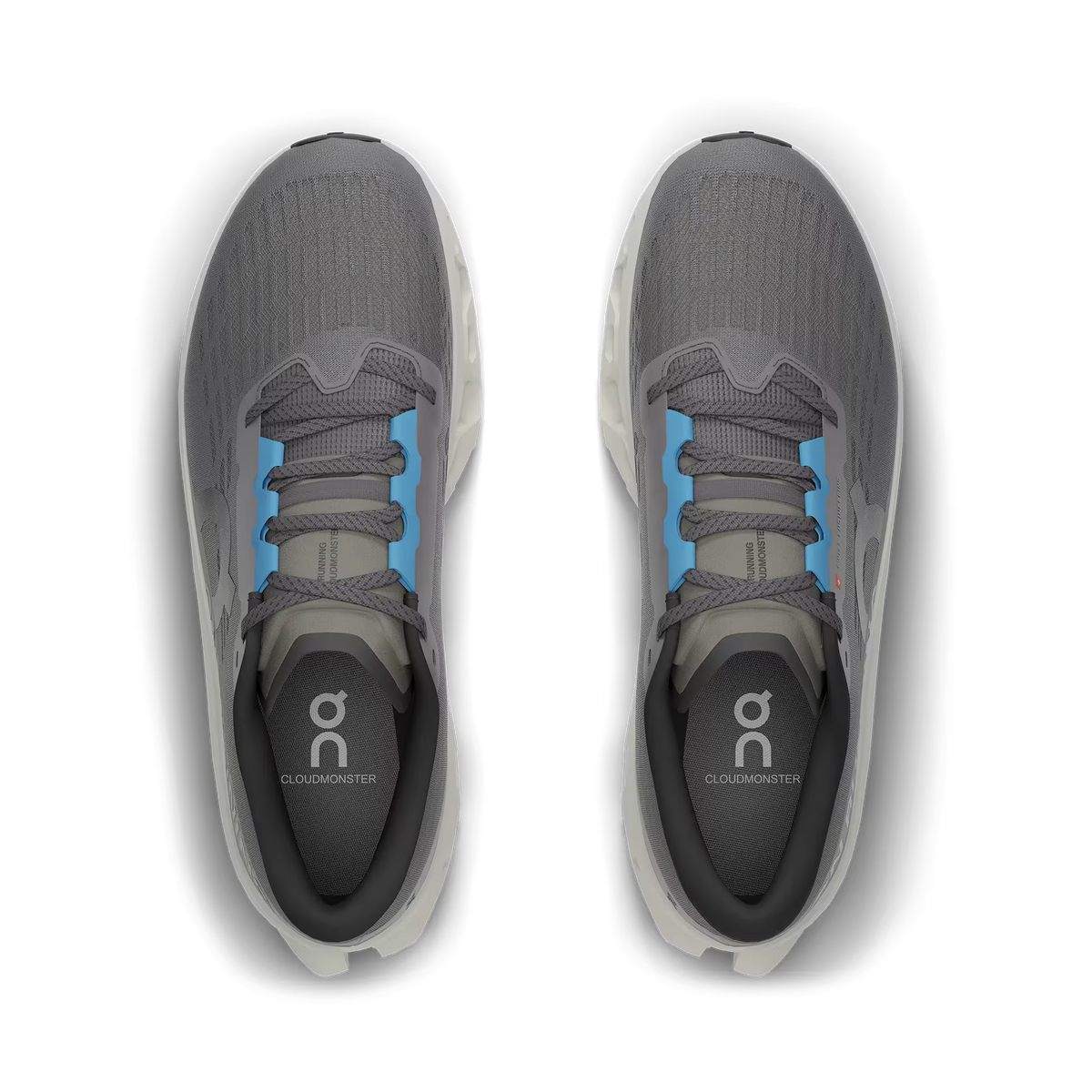 Men's On Running. Cloudmonster 3. Grey upper. Off White midsole. Bottom view.