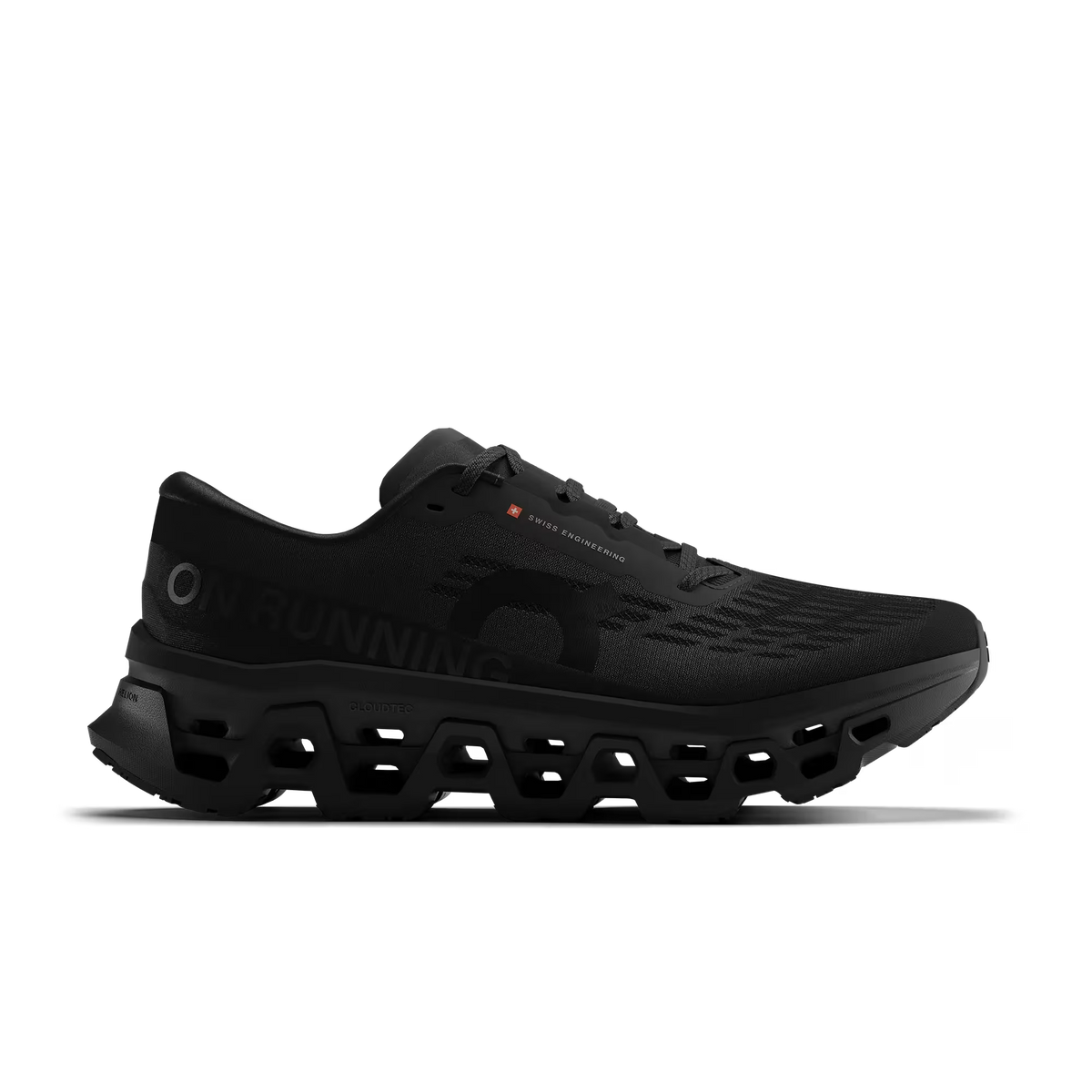 Women's On Running. Cloudmonster 3. Black upper. Black midsole. Lateral view.