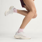 Adidas Adizero Evo SL Exo women's running shoe in Cloud White/Zero Metalic/Core White — on-foot side view